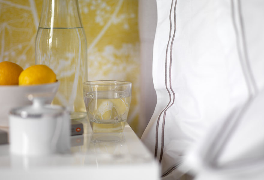 Bedside table next to Grey Cord bedding Bedside table next to Grey Cord bedding