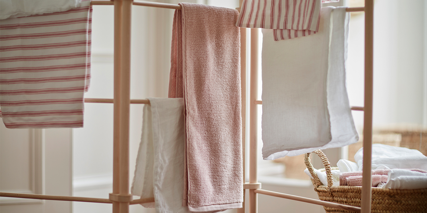Towels and Bed Linen Drying On a Clothes Horse