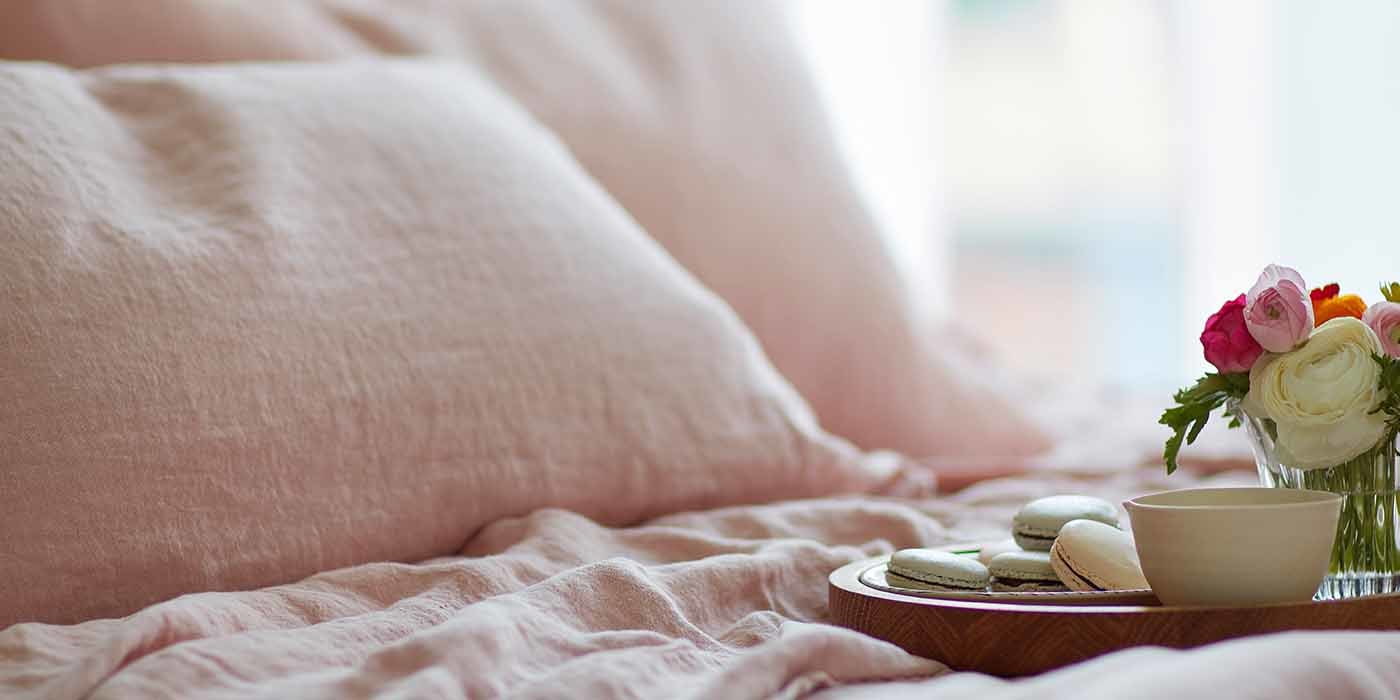 Macrons on Top of Pink Linen Bedding