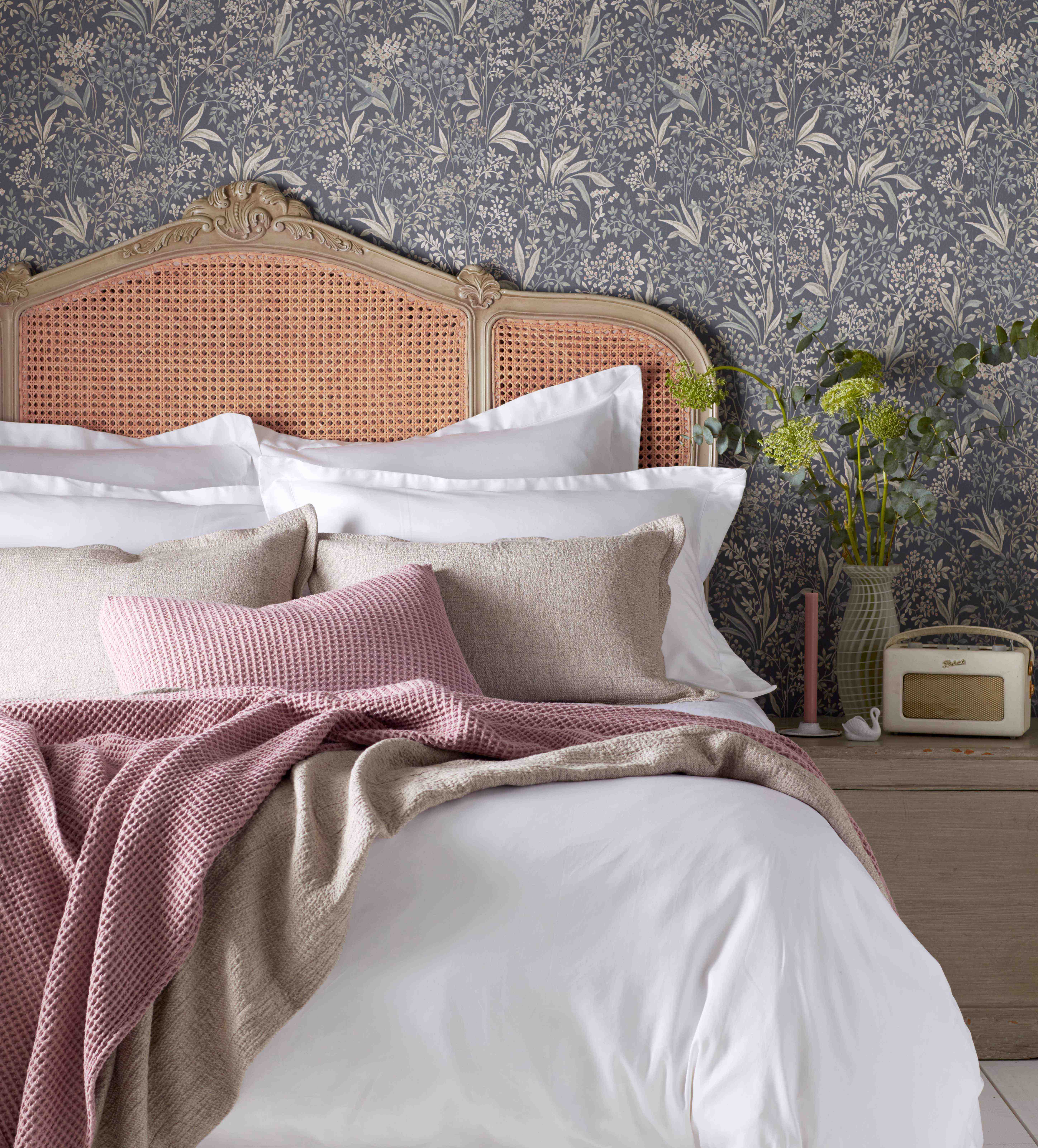 White Luxury Bedding Layered with Bedroom Accessories